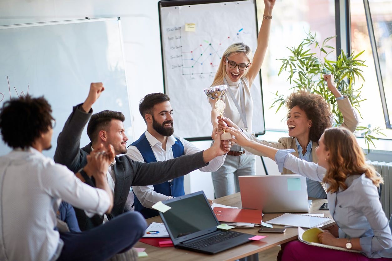 coworkers celebrating improved lead generation from their custom website